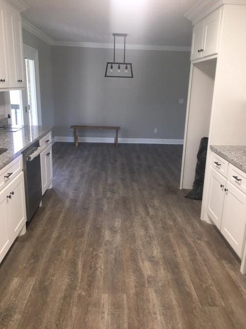 kitchen featuring dark wood-type flooring, white cabinets, crown molding, light stone countertops, and dishwashing machine