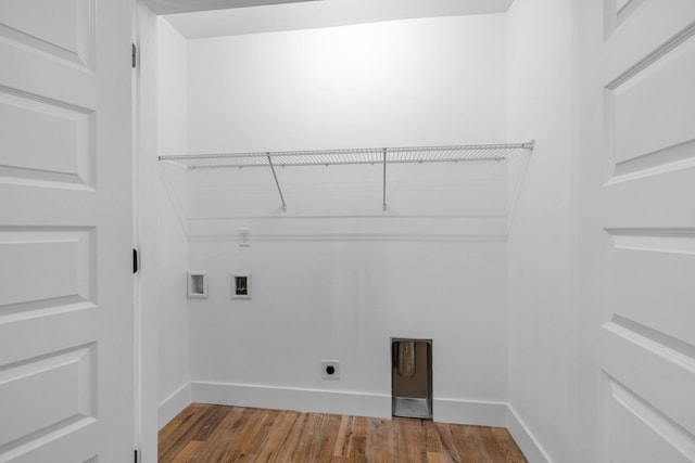 clothes washing area featuring hardwood / wood-style floors, electric dryer hookup, and hookup for a washing machine