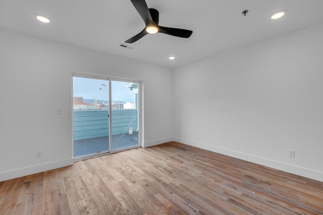 unfurnished room with ceiling fan and light hardwood / wood-style flooring