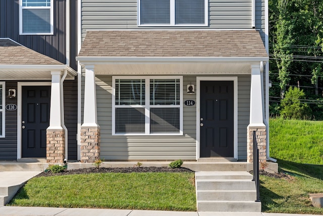 property entrance with a yard