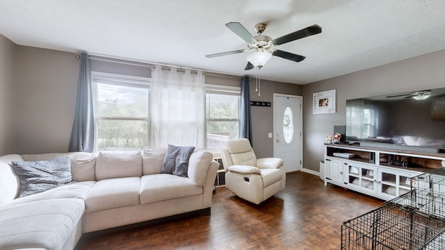 living room featuring dark hardwood / wood-style floors and ceiling fan