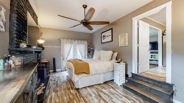 bedroom featuring ceiling fan and hardwood / wood-style flooring