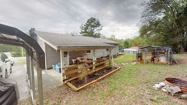 rear view of property with a yard