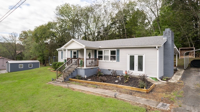 ranch-style home featuring a carport and a front lawn