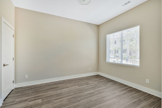 spare room featuring hardwood / wood-style floors