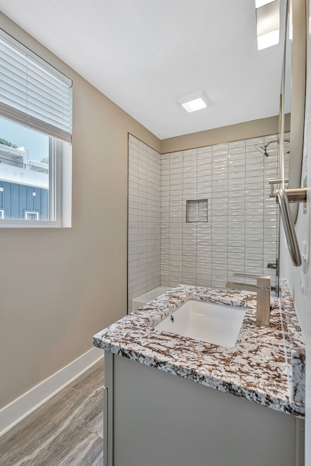 bathroom featuring wood-type flooring and vanity