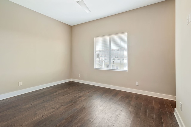 empty room featuring dark wood-type flooring