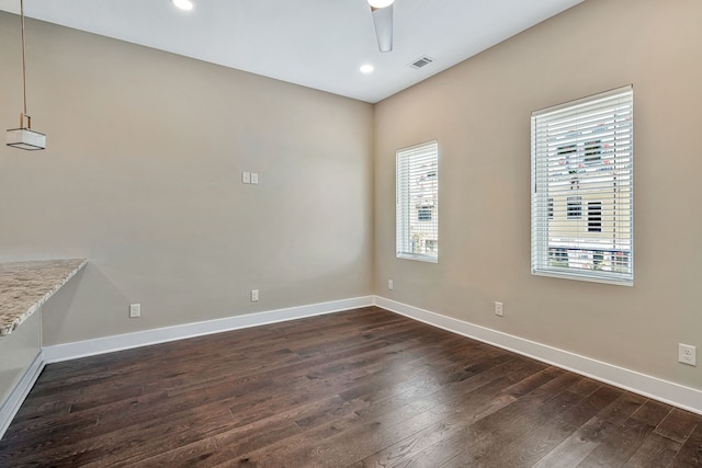 interior space with dark wood-type flooring, ceiling fan, and a healthy amount of sunlight