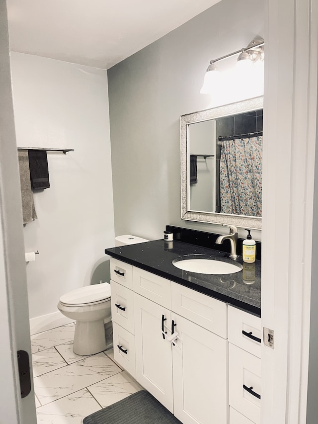 bathroom with vanity and toilet