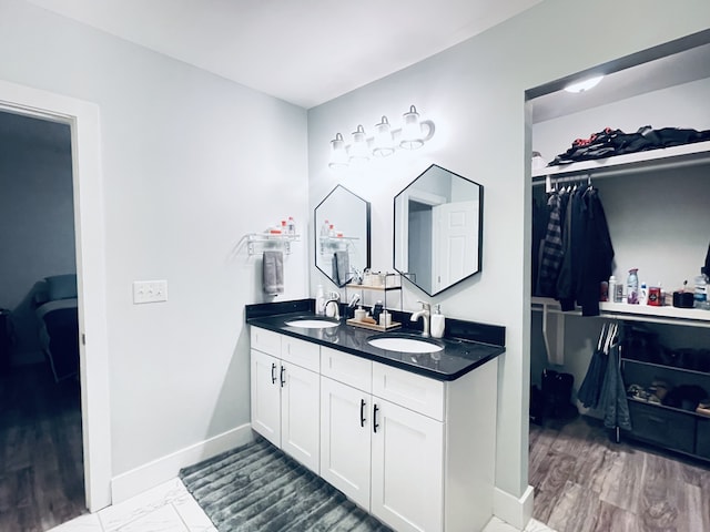 bathroom with vanity and hardwood / wood-style floors