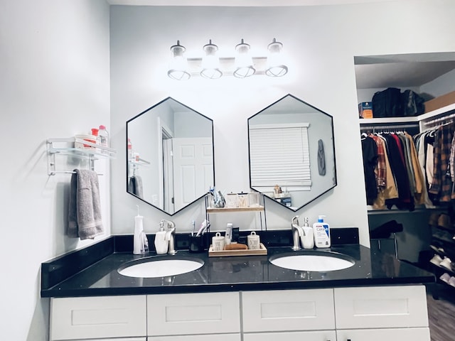 bathroom with vanity and hardwood / wood-style floors