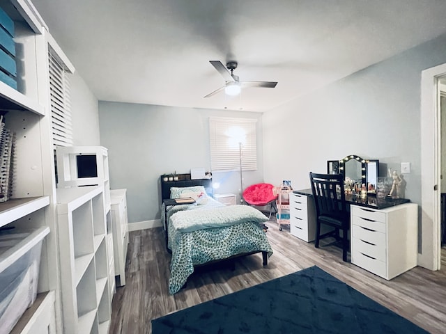 bedroom with hardwood / wood-style flooring and ceiling fan