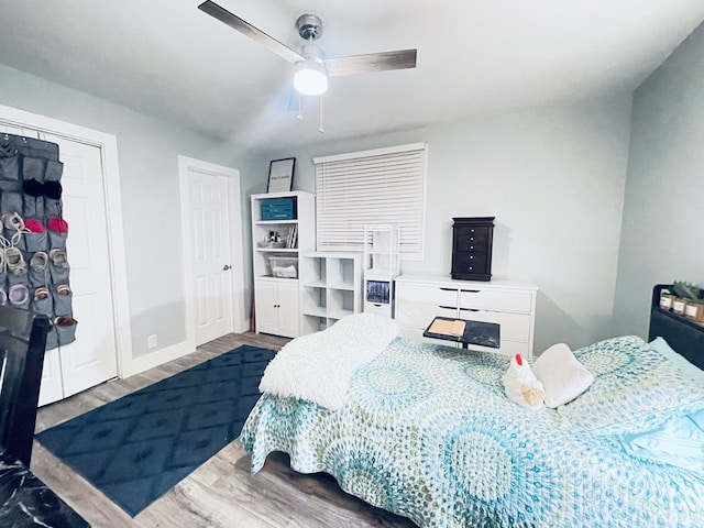 bedroom featuring hardwood / wood-style flooring and ceiling fan