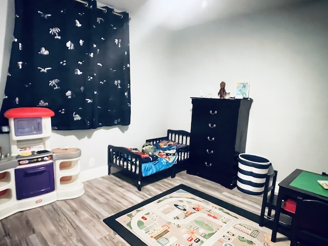 bedroom featuring hardwood / wood-style floors