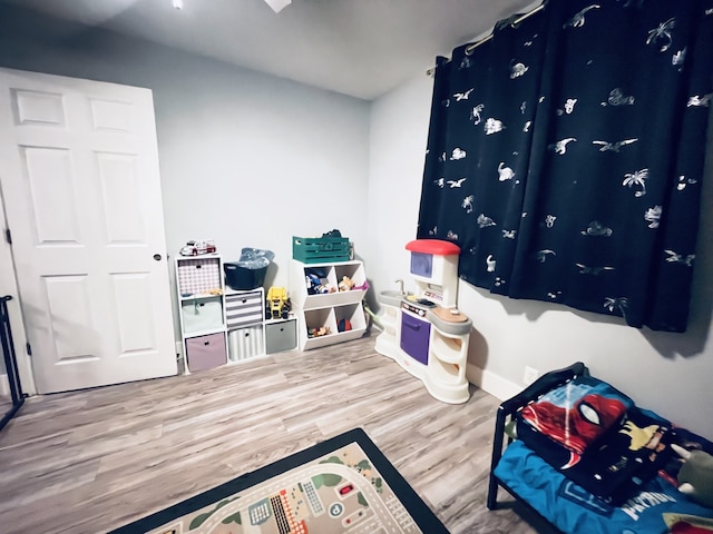 game room featuring hardwood / wood-style floors