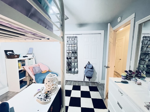 bedroom featuring a closet and dark wood-type flooring