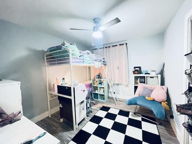 bedroom featuring hardwood / wood-style floors and ceiling fan