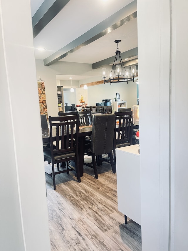 dining room with a notable chandelier and hardwood / wood-style flooring