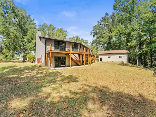 rear view of property with a yard