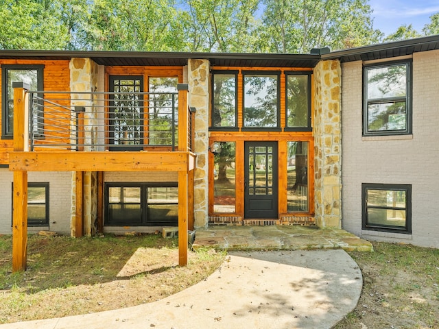 doorway to property with a patio and a balcony