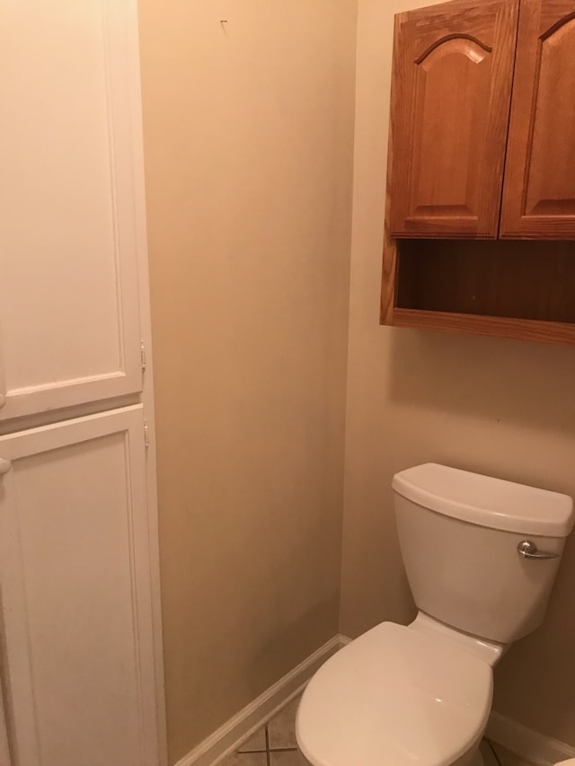 bathroom with tile patterned floors and toilet