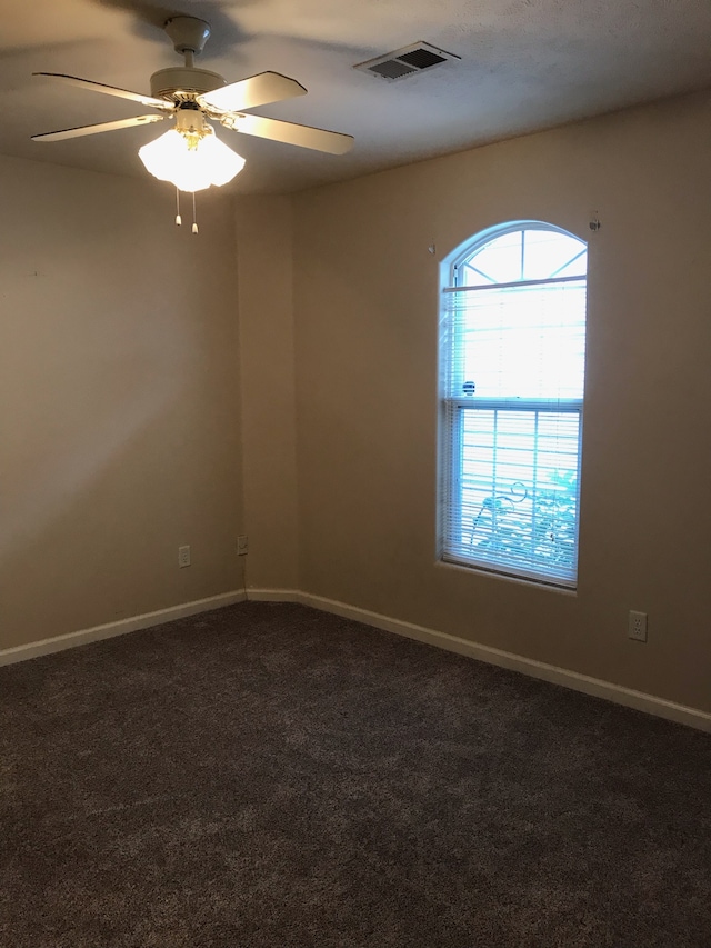 carpeted empty room with ceiling fan