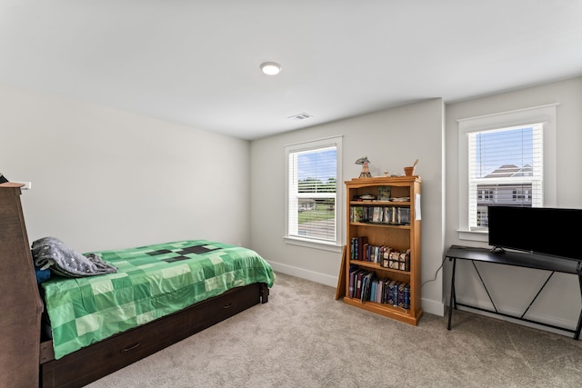 bedroom with light carpet