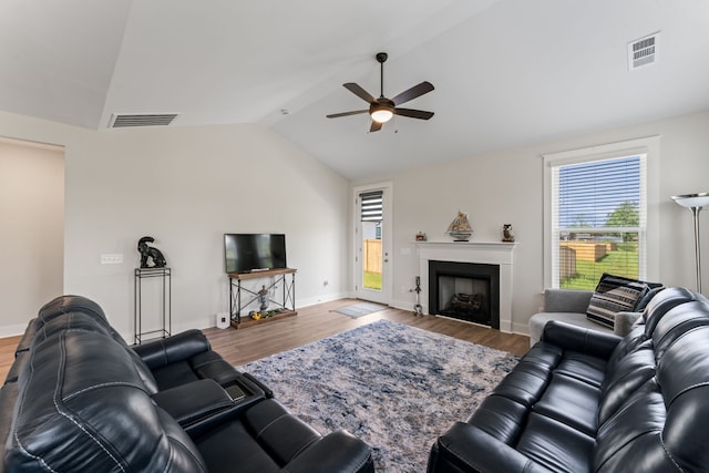 living room featuring lofted ceiling, ceiling fan, and hardwood / wood-style floors