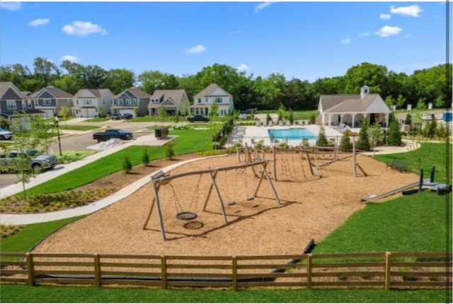 view of property's community with a playground and a swimming pool