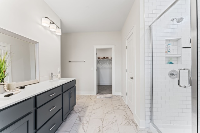 bathroom featuring vanity and a shower with door