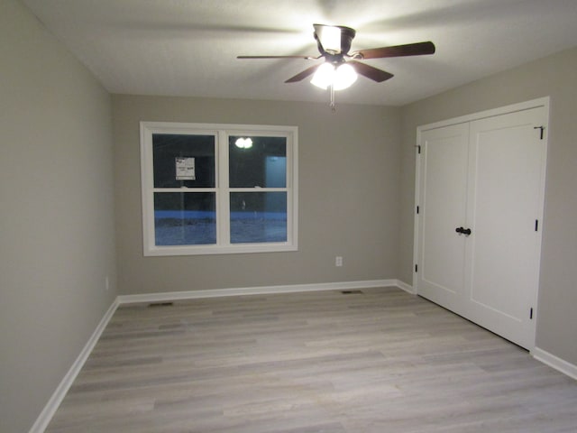 unfurnished bedroom with light hardwood / wood-style flooring and ceiling fan