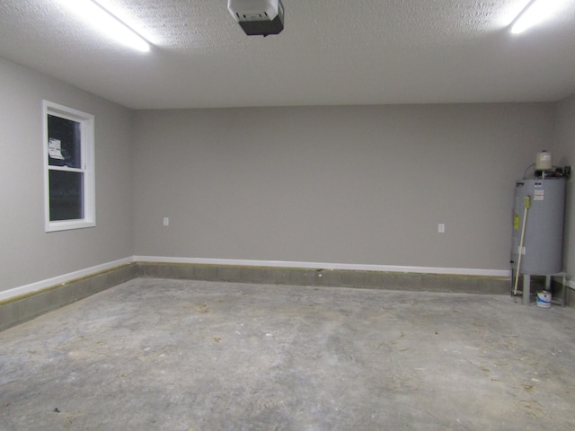 garage featuring water heater and a garage door opener