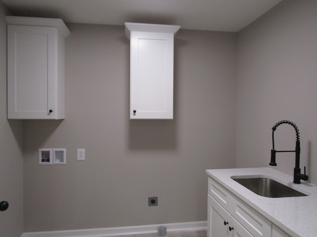 clothes washing area featuring cabinets, hookup for an electric dryer, hookup for a washing machine, and sink