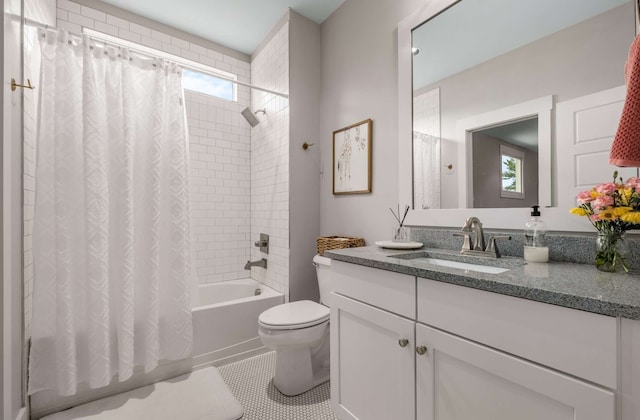 full bathroom featuring vanity, tile patterned flooring, toilet, and shower / tub combo with curtain