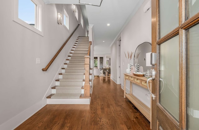 entryway with dark wood-type flooring