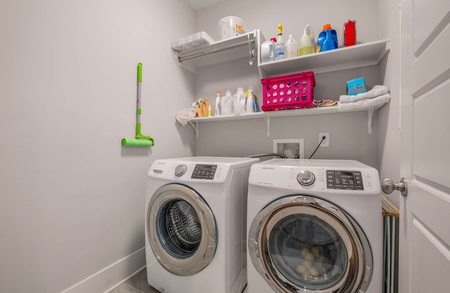 laundry area with independent washer and dryer