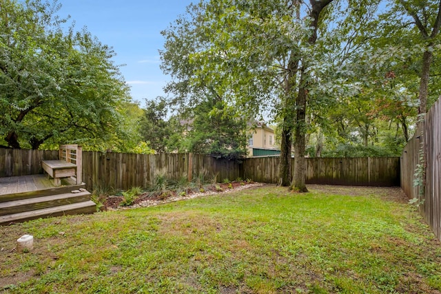 view of yard featuring a wooden deck