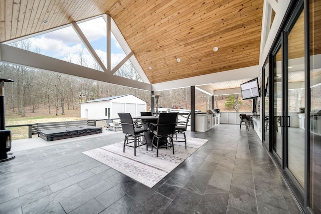 view of patio featuring a storage shed and an outdoor kitchen