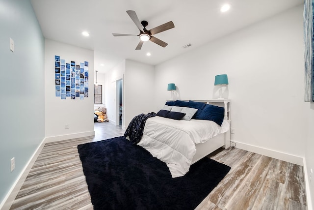 bedroom featuring light wood-type flooring and ceiling fan