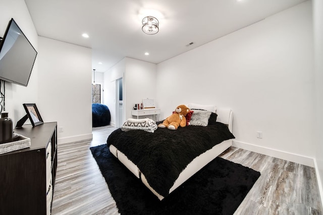 bedroom featuring light wood-type flooring