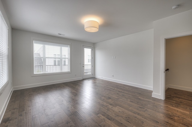 empty room featuring dark hardwood / wood-style floors