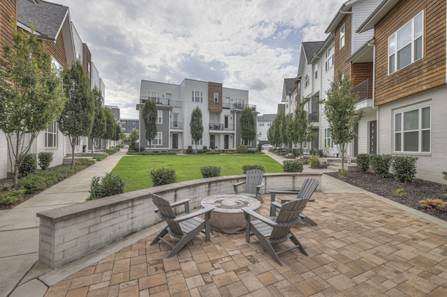 view of patio with a fire pit