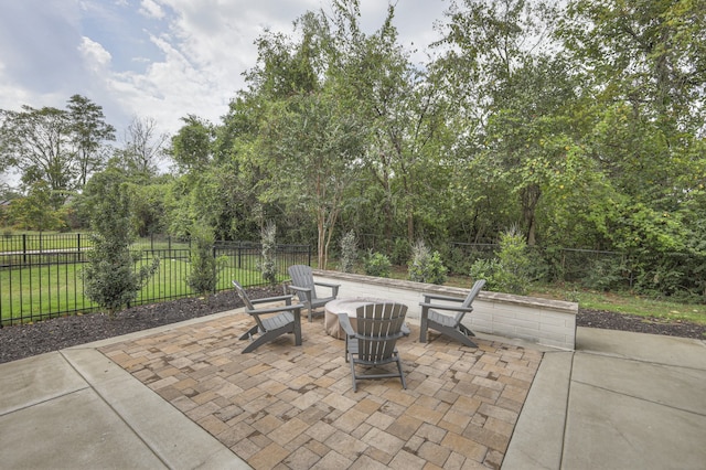 view of patio / terrace featuring an outdoor fire pit