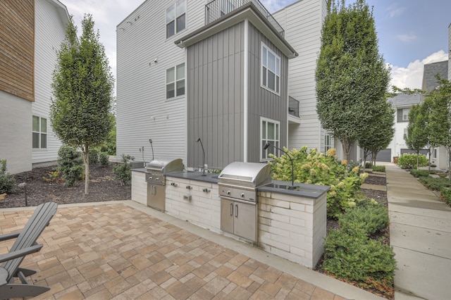 view of patio / terrace with a grill and an outdoor kitchen