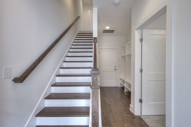 stairway with wood-type flooring