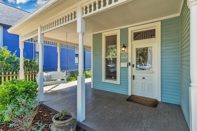 property entrance with covered porch