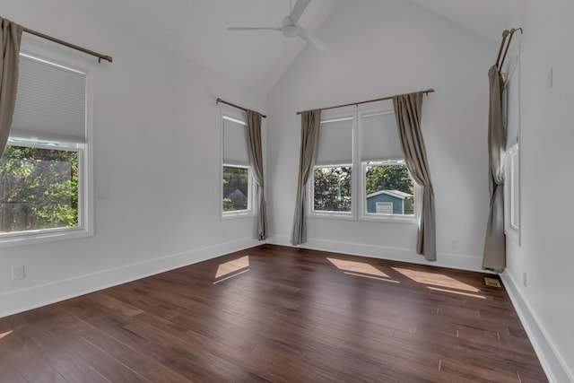 spare room with ceiling fan, dark hardwood / wood-style flooring, and high vaulted ceiling