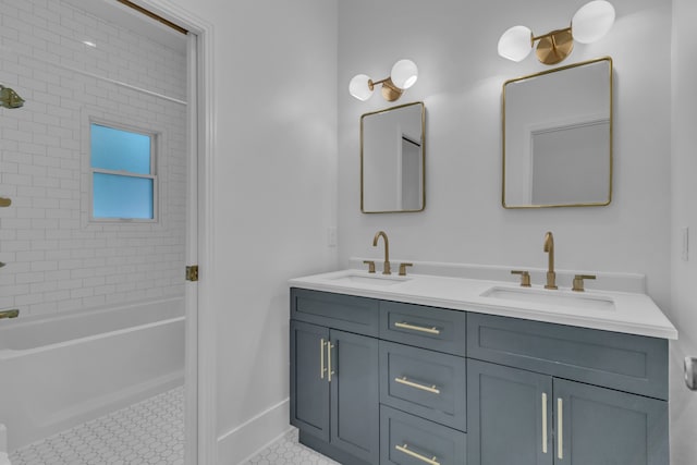 bathroom with tile patterned floors, vanity, and tiled shower / bath