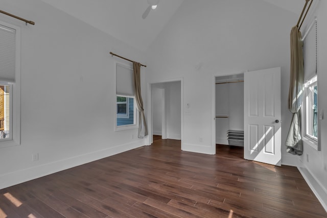 unfurnished bedroom featuring dark hardwood / wood-style floors, high vaulted ceiling, and ceiling fan