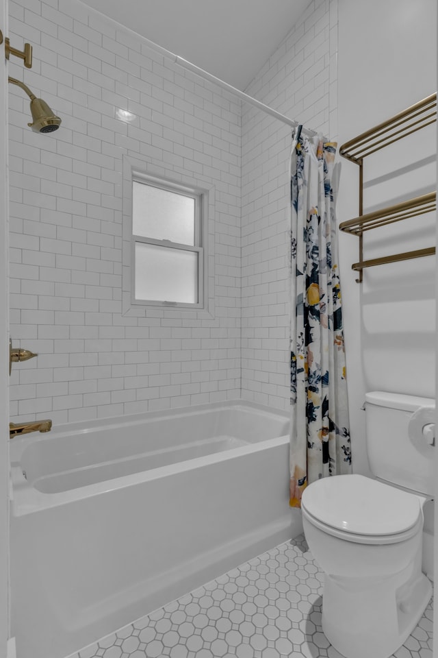 bathroom with tile patterned flooring, vaulted ceiling, shower / bath combo with shower curtain, and toilet